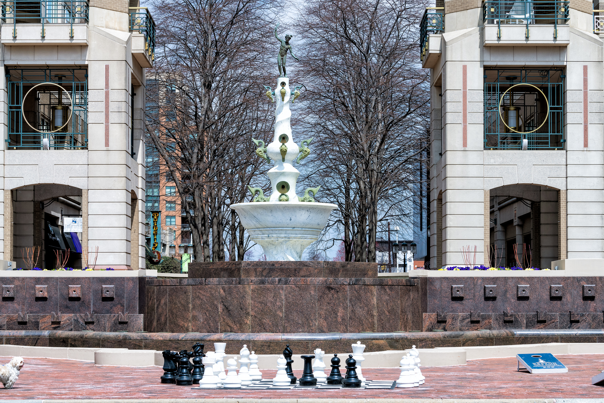 Reston town center building architecture sidewalk in northern Virginia with water fountain