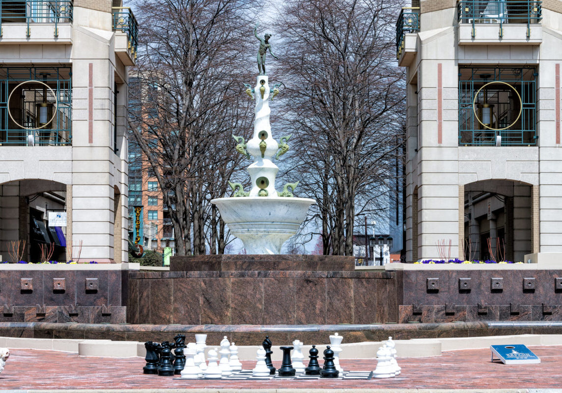 Reston town center building architecture sidewalk in northern Virginia with water fountain
